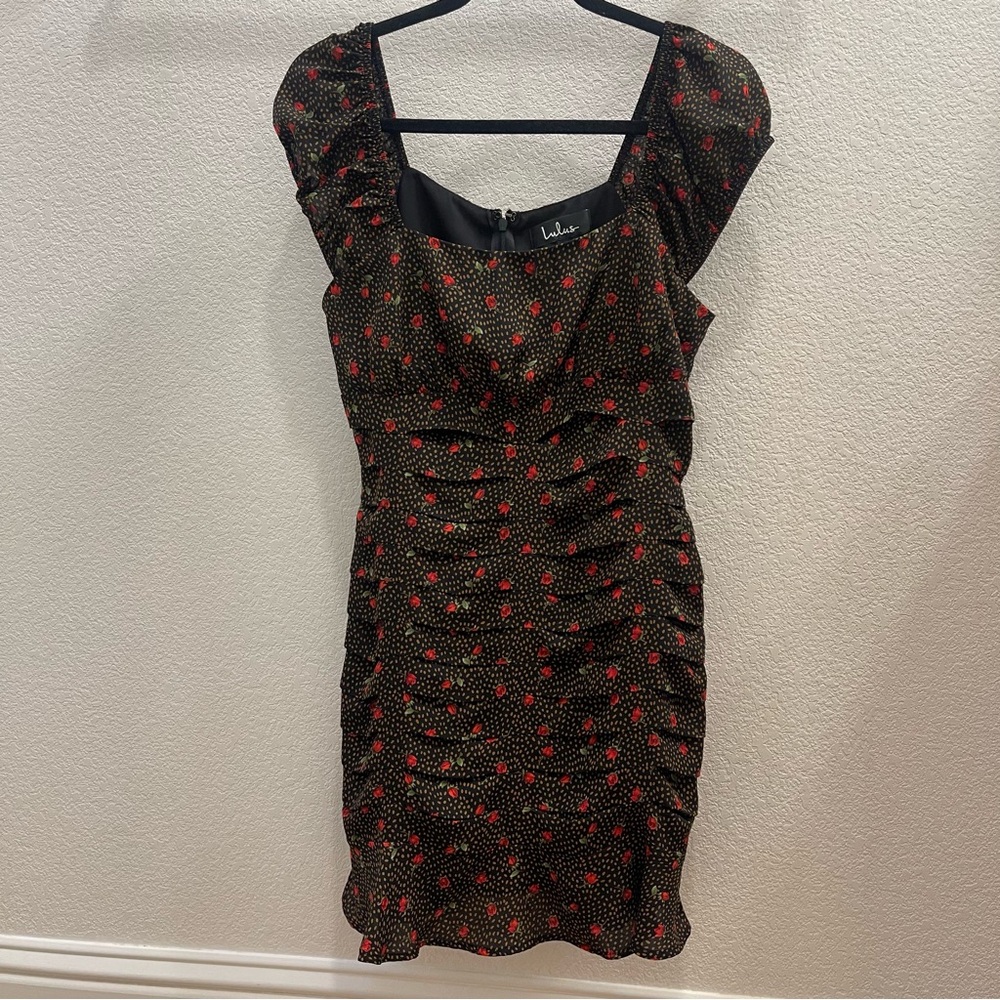 Lulu’s black dress with polka dots and roses